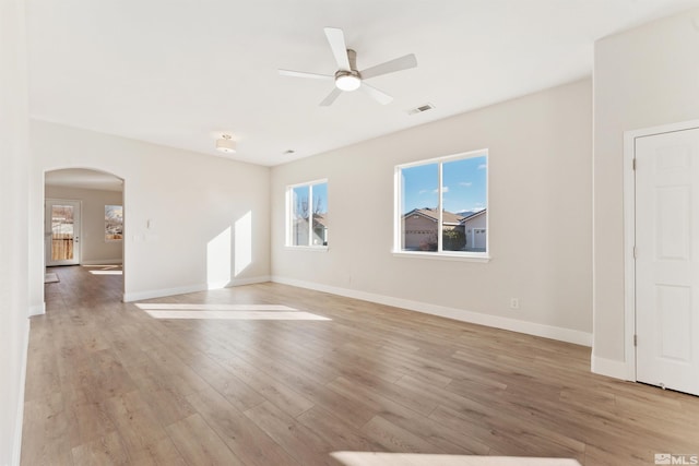 spare room featuring light hardwood / wood-style floors and ceiling fan