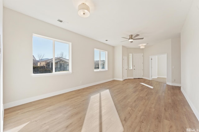 spare room with light hardwood / wood-style floors and ceiling fan