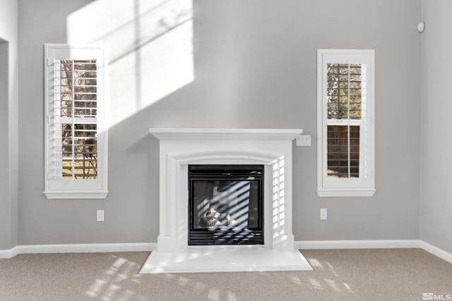 unfurnished living room with carpet floors