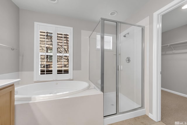 bathroom with shower with separate bathtub and vanity