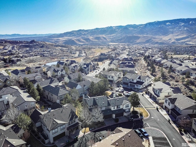 birds eye view of property featuring a mountain view