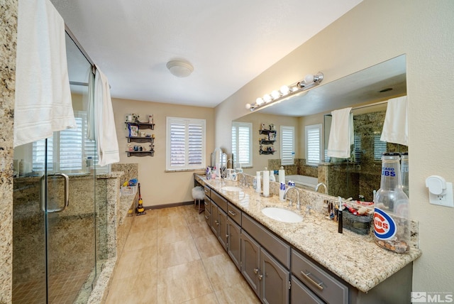 bathroom with vanity, tile patterned floors, and plus walk in shower