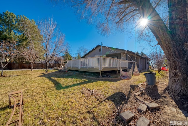 exterior space with a deck and a yard