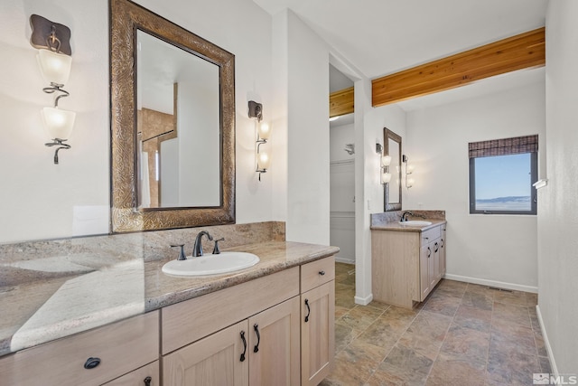 bathroom with walk in shower, beamed ceiling, and vanity