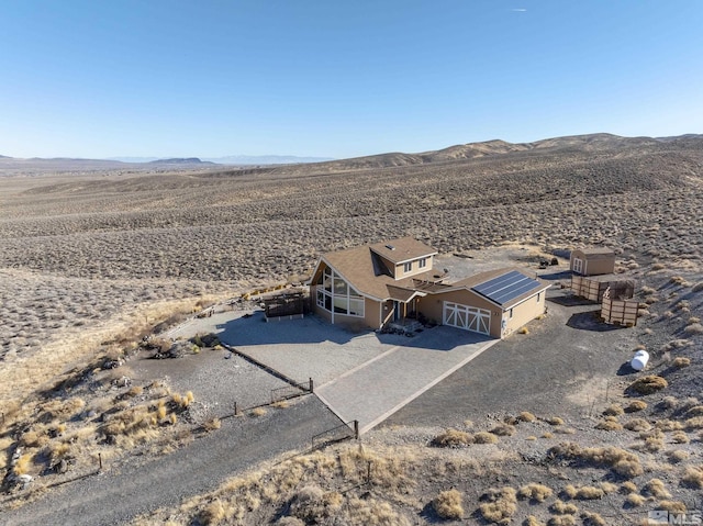 drone / aerial view featuring a mountain view