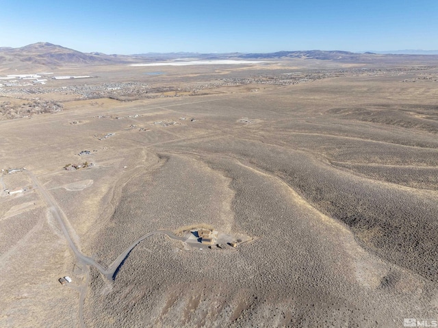 drone / aerial view featuring a mountain view