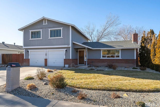 view of front of house with a front yard and a garage