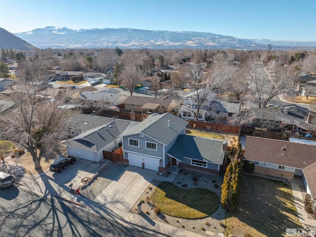 birds eye view of property featuring a mountain view