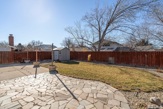 view of yard featuring a storage unit and a patio