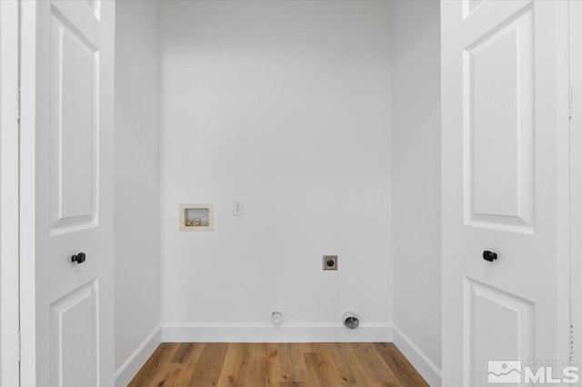 laundry area featuring gas dryer hookup, washer hookup, hardwood / wood-style floors, and hookup for an electric dryer