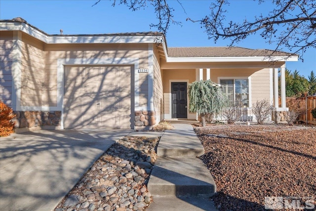 view of front of house with covered porch and a garage