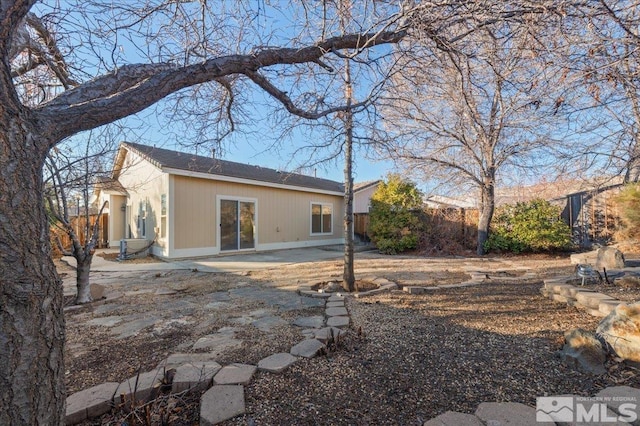 rear view of house featuring a patio