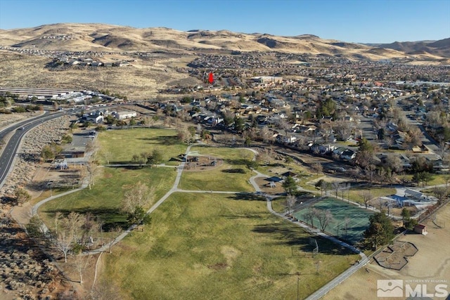 birds eye view of property featuring a mountain view