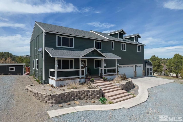 view of front of property featuring a garage and covered porch