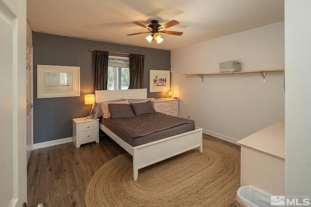 bedroom featuring ceiling fan and dark wood-type flooring