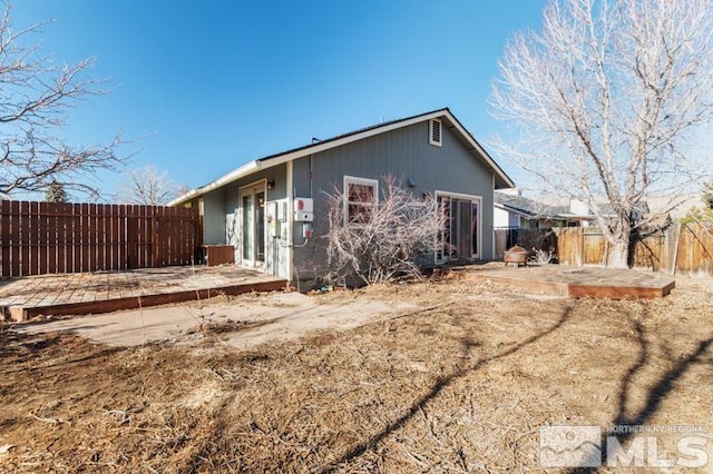 back of property with a patio area