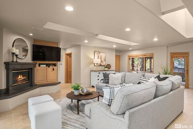 tiled living room with a skylight