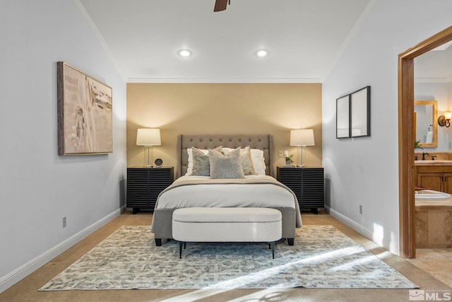 bedroom featuring sink, vaulted ceiling, ceiling fan, connected bathroom, and crown molding