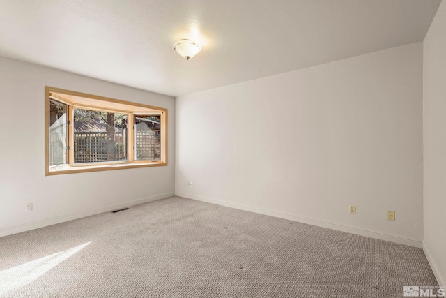 view of carpeted spare room