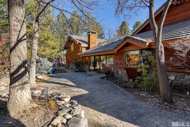 view of property exterior featuring a patio