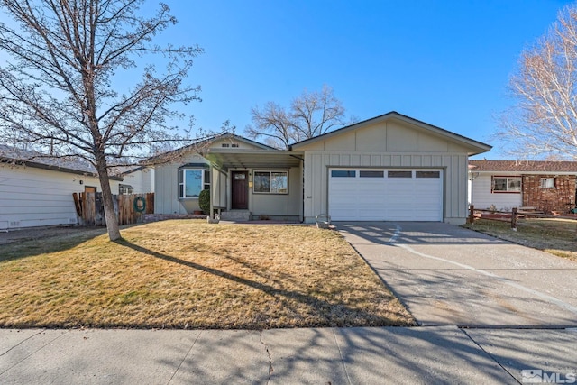 ranch-style house featuring a garage and a front lawn