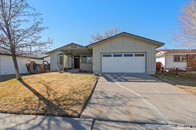 ranch-style home featuring a front lawn and a garage