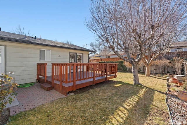 view of yard featuring a patio and a wooden deck