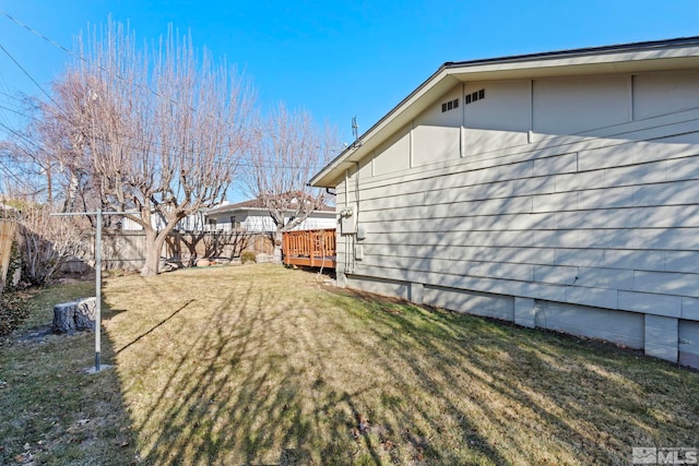 view of yard with a wooden deck