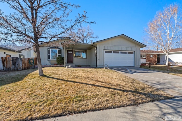 ranch-style home featuring a front yard and a garage