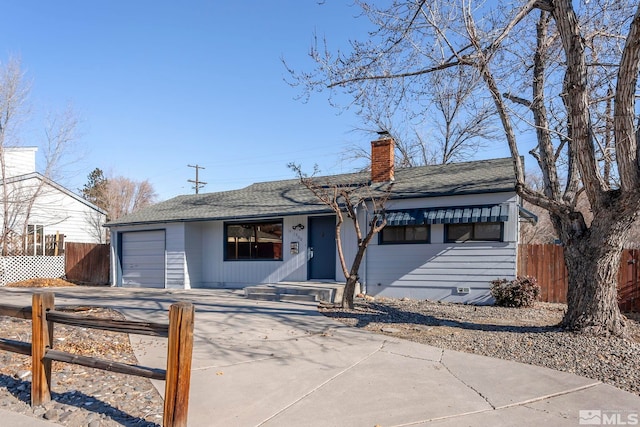 single story home with a garage