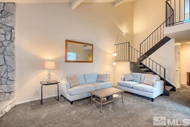 carpeted living room with vaulted ceiling with beams