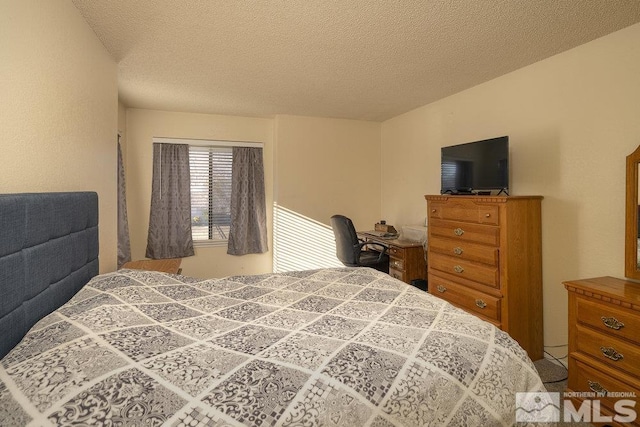 bedroom featuring a textured ceiling