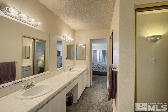 bathroom featuring vanity and a textured ceiling