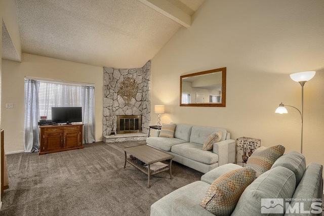 carpeted living room featuring a textured ceiling, lofted ceiling with beams, and a stone fireplace