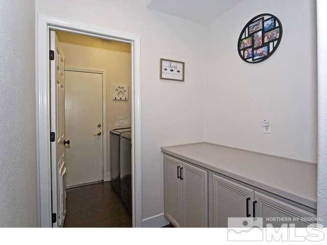 hallway with washing machine and clothes dryer