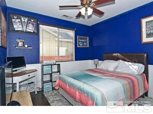 bedroom featuring hardwood / wood-style floors and ceiling fan