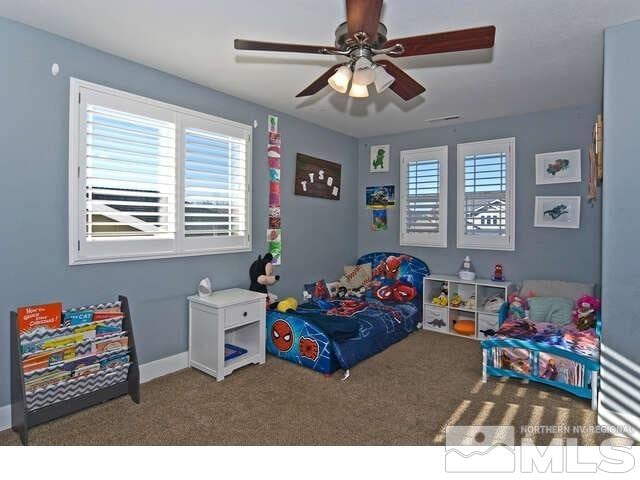 carpeted bedroom featuring ceiling fan