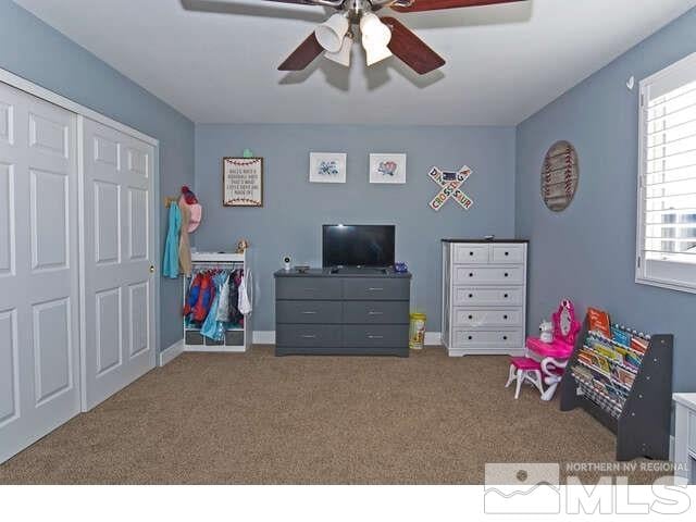 playroom featuring ceiling fan and light carpet