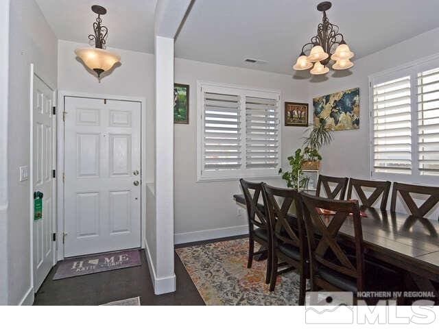 dining space featuring an inviting chandelier