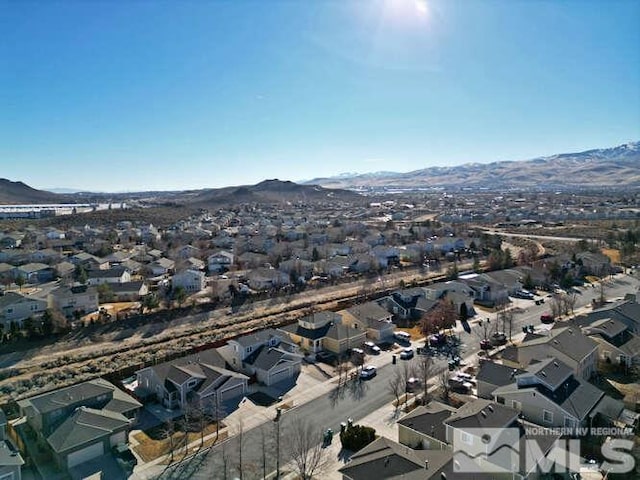 drone / aerial view featuring a mountain view