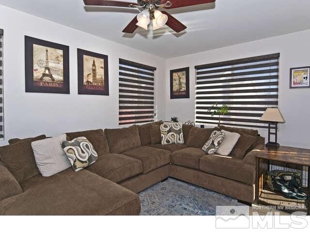 living room featuring ceiling fan