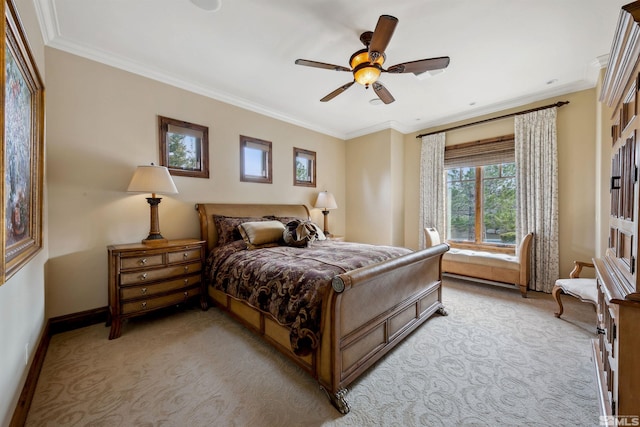 carpeted bedroom with ceiling fan and crown molding