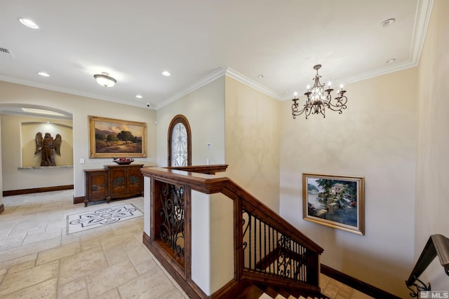 hallway featuring an inviting chandelier and crown molding