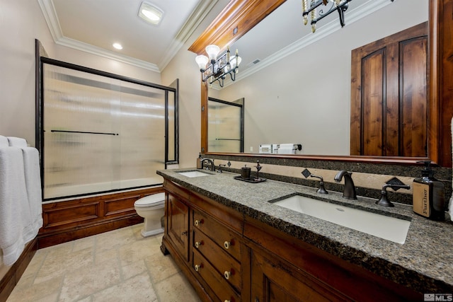 full bathroom featuring toilet, vanity, a notable chandelier, ornamental molding, and shower / bath combination with glass door