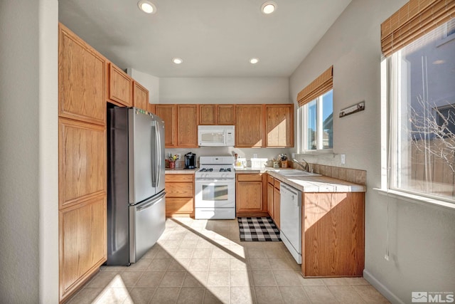 kitchen featuring sink and white appliances