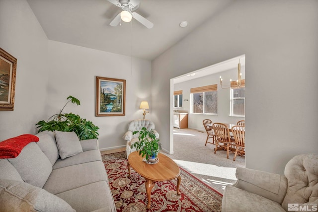 living room featuring lofted ceiling, carpet flooring, and ceiling fan