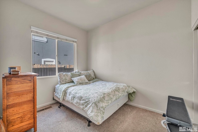 bedroom with light carpet