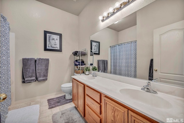 bathroom featuring vanity, curtained shower, tile patterned floors, and toilet