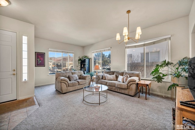 carpeted living room featuring a notable chandelier