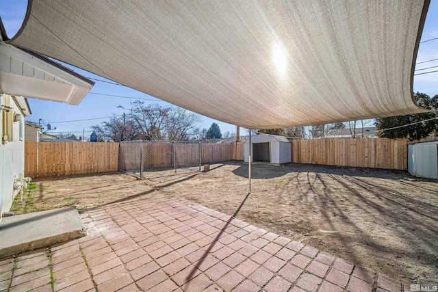 view of patio / terrace featuring a storage shed